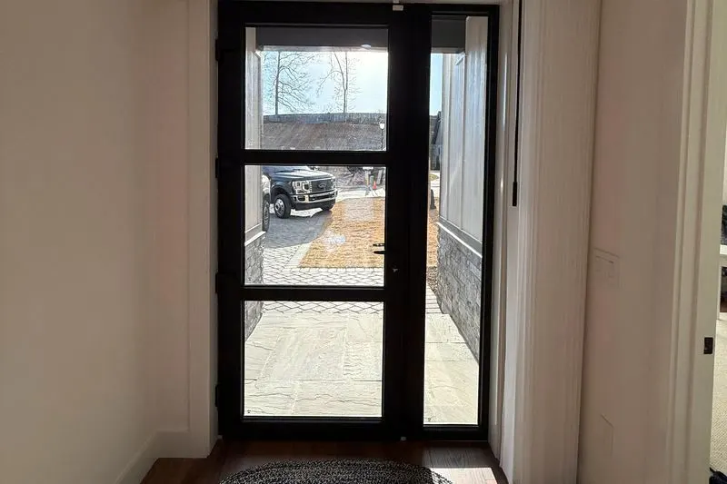 SmartDrape stacked beside a glass entry door
