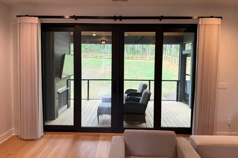 SmartDrape stacked at both sides of a four-panel door to a screened porch