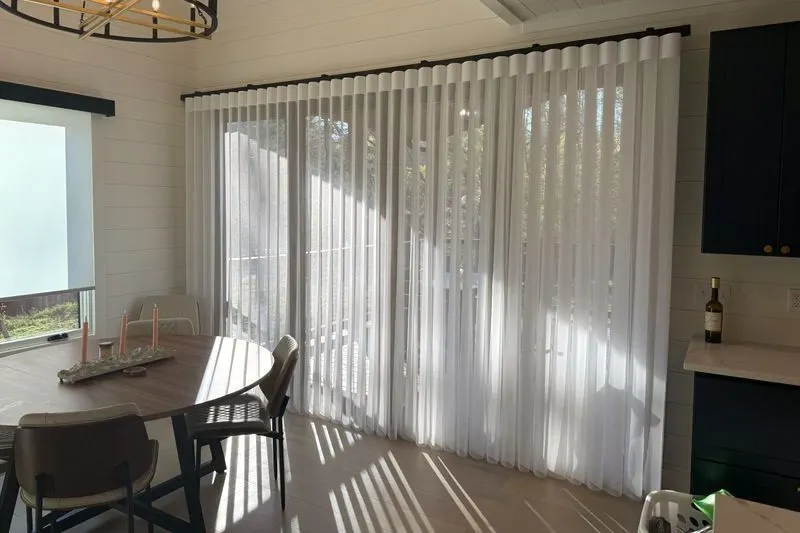 Afternoon light glowing through closed SmartDrape fabric vanes