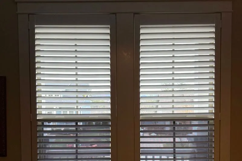 Plantation shutter panels with louvers tilted open